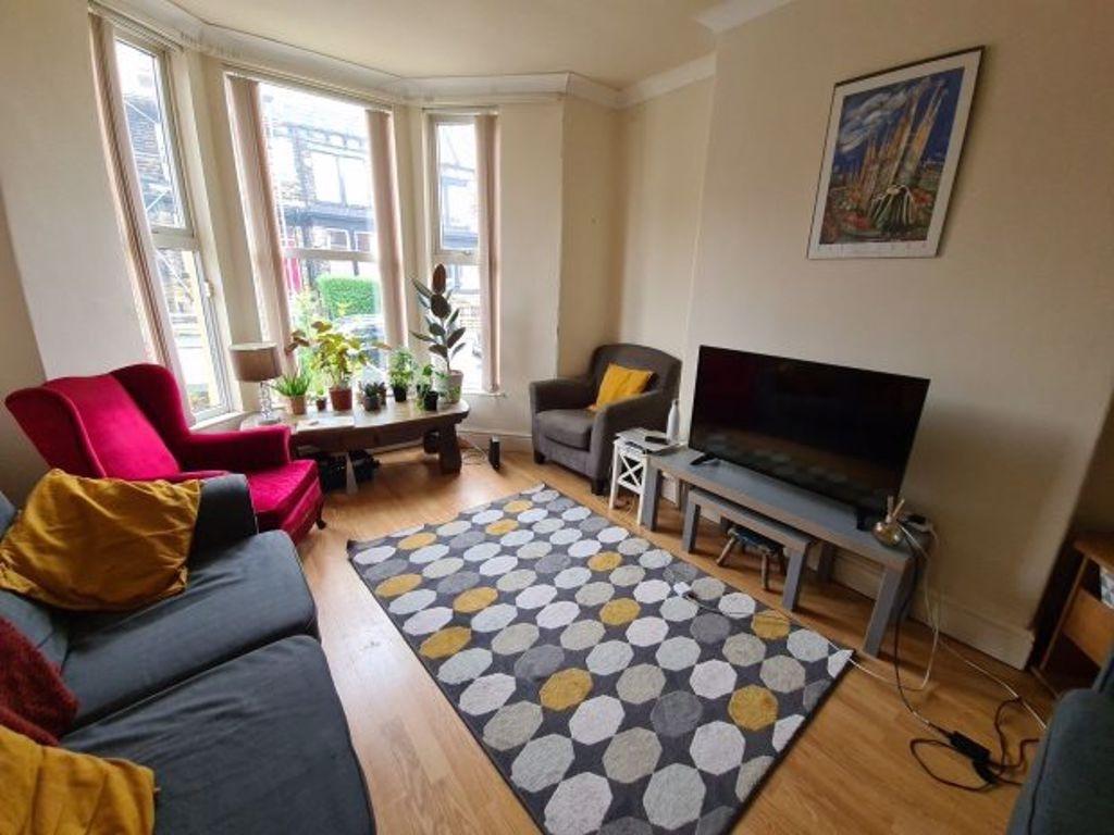 A bright and inviting living room featuring a l...