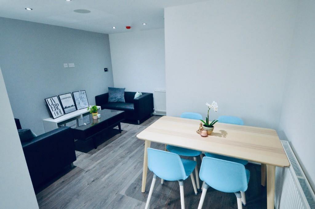 A spacious and modern living room perfect for s...