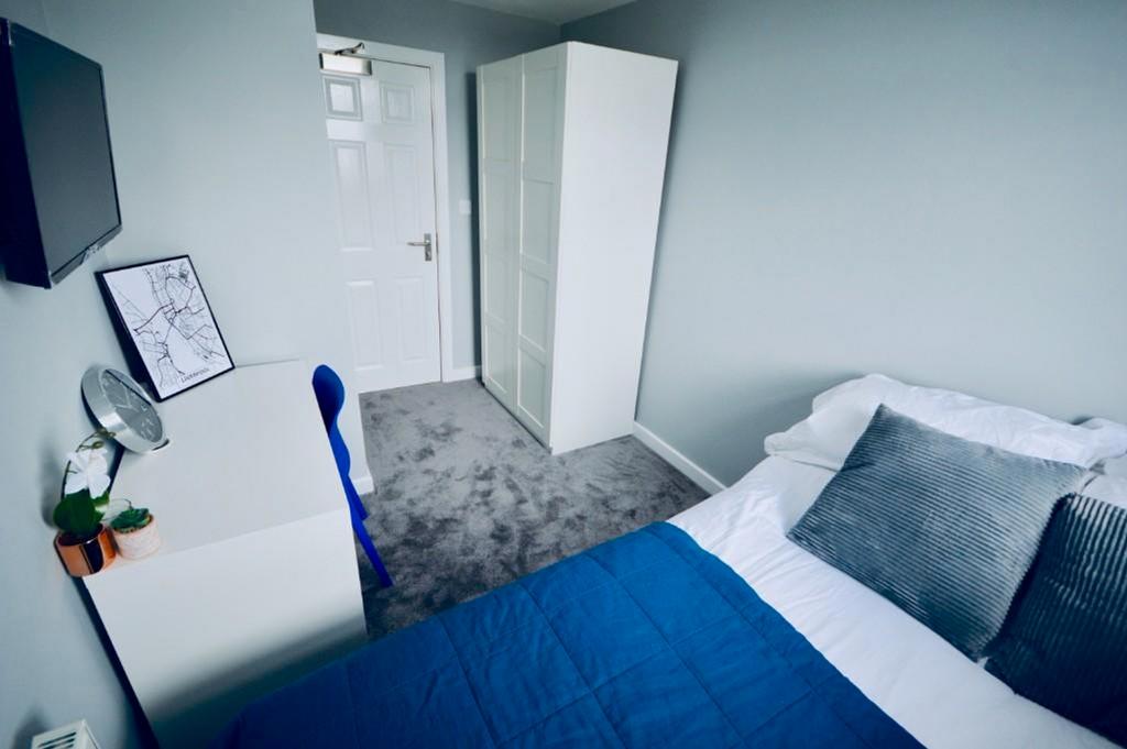 A stylish and inviting double bedroom featuring...