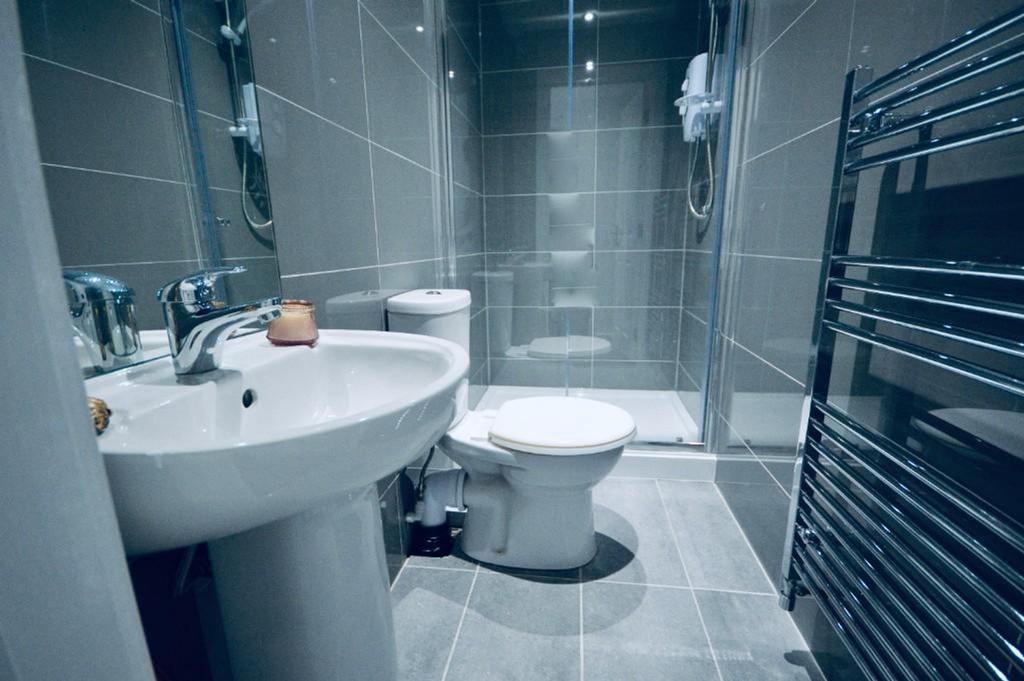 A modern and clean bathroom featuring a sleek d...