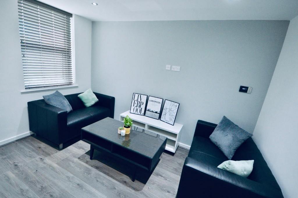 A bright and inviting living room with modern d...