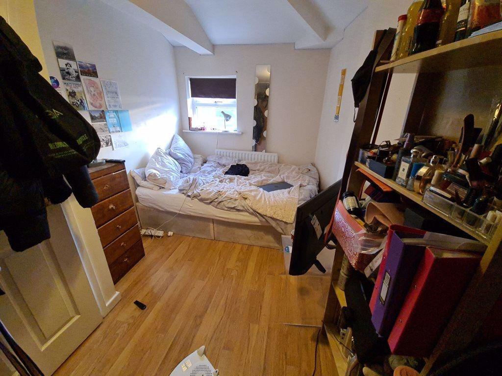 A compact, tidy bathroom featuring a toilet and...