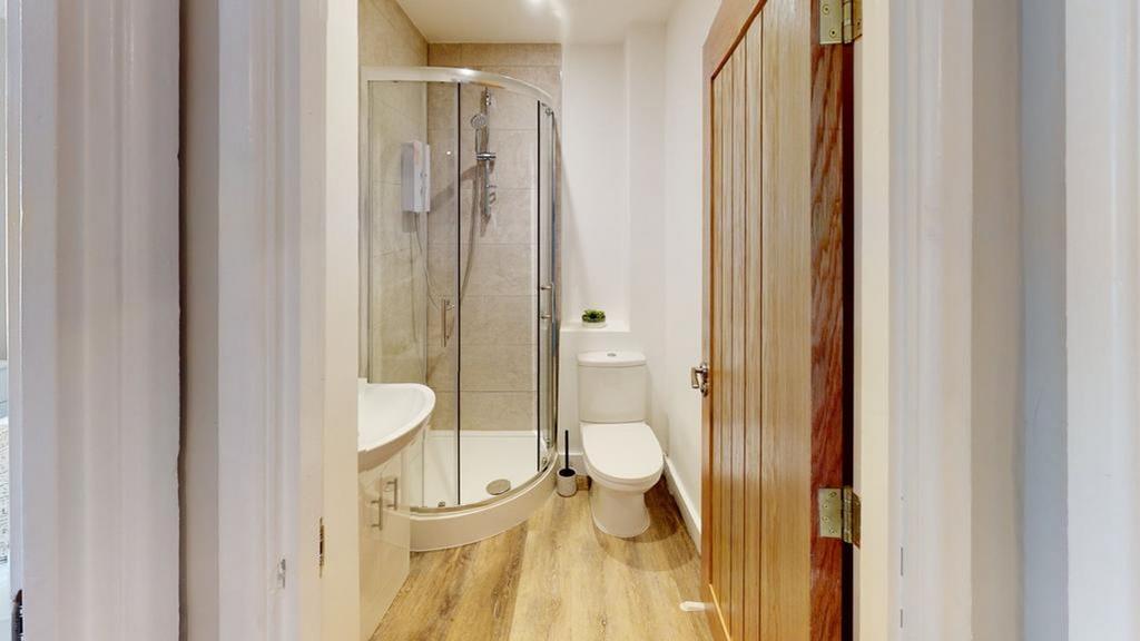 A modern and tidy bathroom featuring a stylish ...