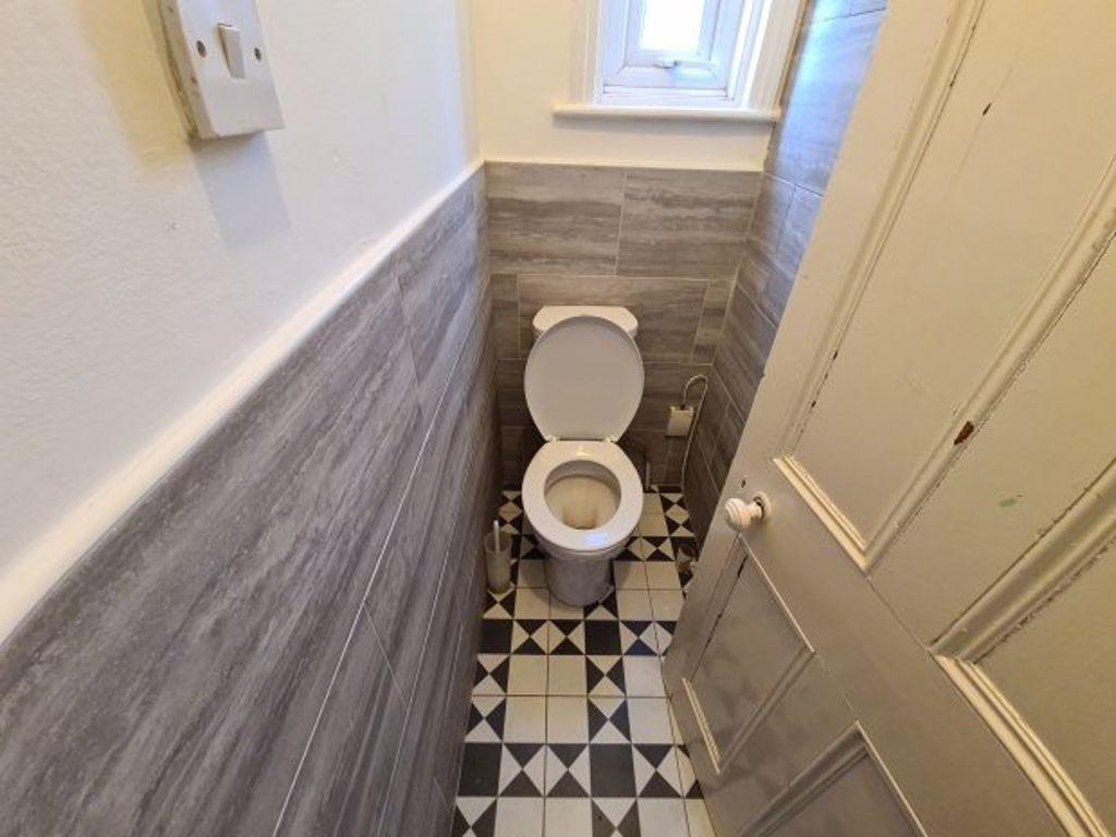A clean and well-maintained compact toilet with...