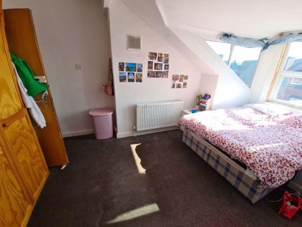 Bright and cozy double bedroom featuring a comf...