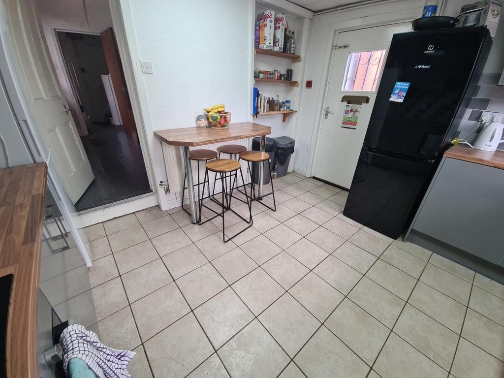 Bright and tidy kitchen space featuring ample f...