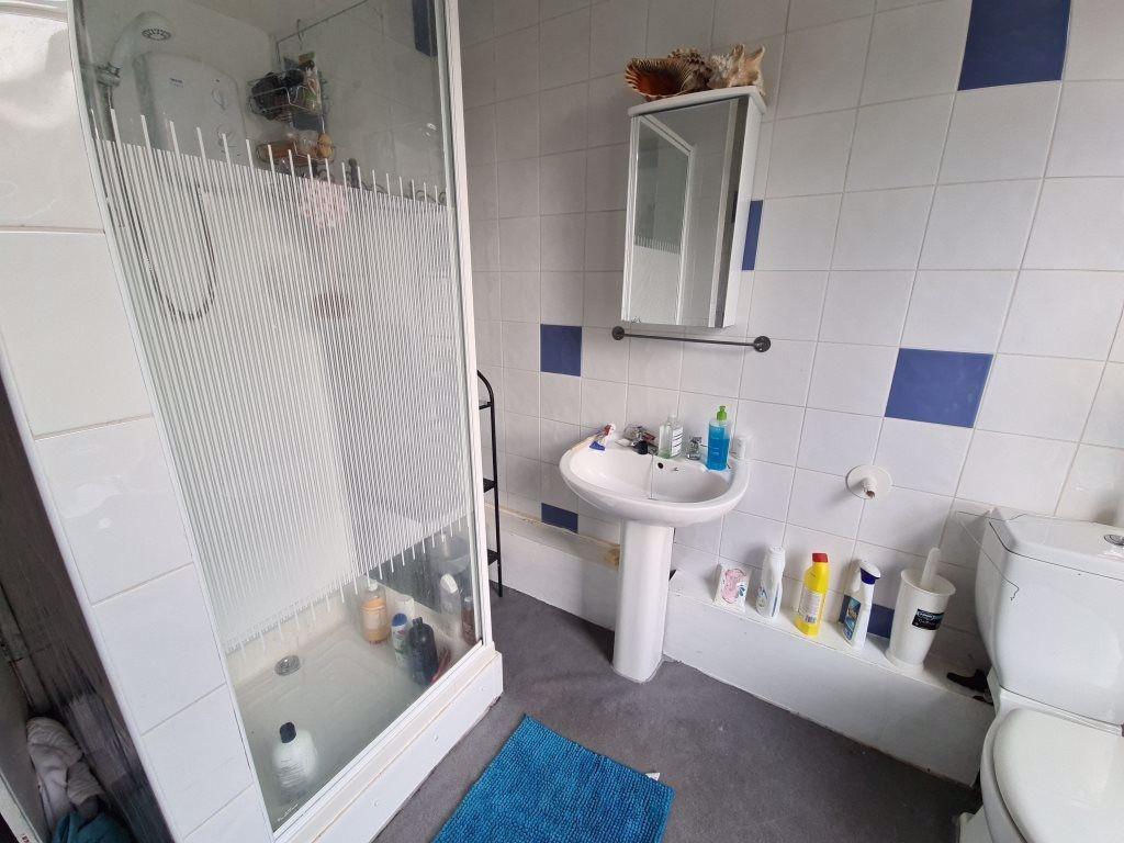 A clean, well-maintained bathroom featuring a s...