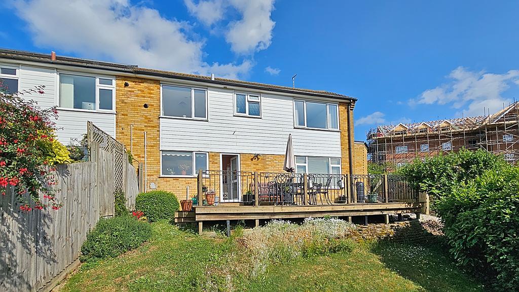 A house with a deck and a garden.