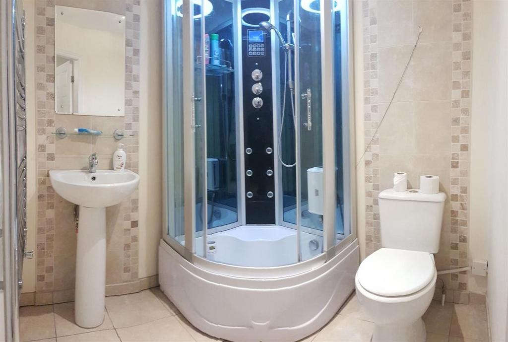 A clean and modern bathroom featuring a spaciou...