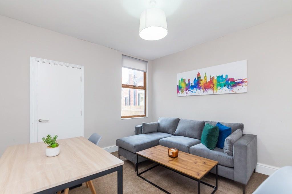 Bright and inviting living room featuring a com...