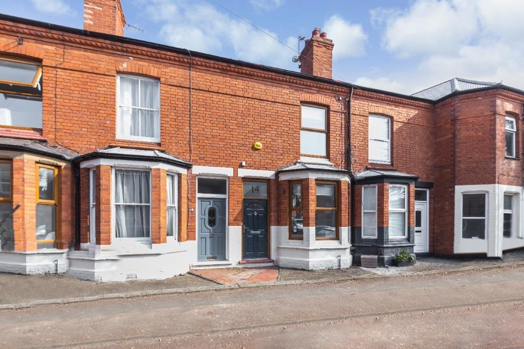 A charming terraced brick house with bay window...