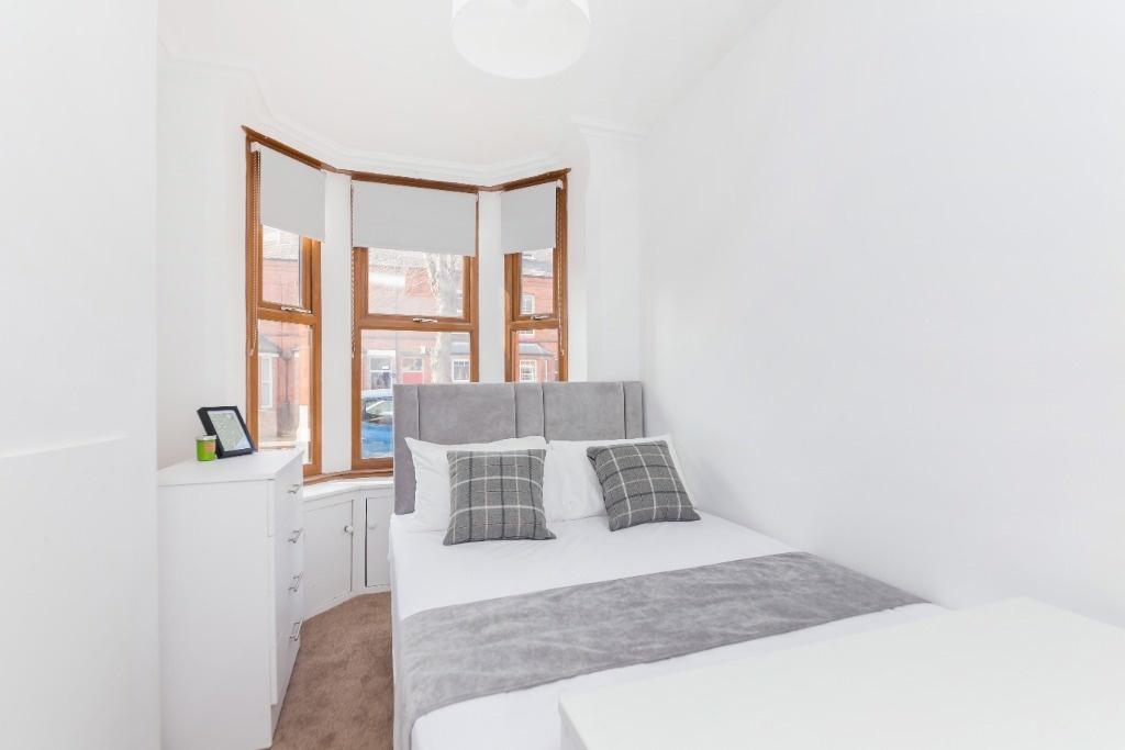 Bright and inviting double bedroom featuring a ...