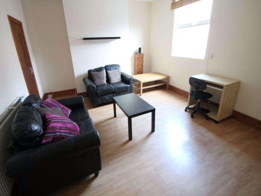 A bright and tidy living room featuring comfort...