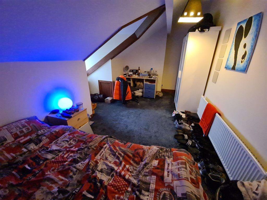 Cozy double bedroom featuring a comfortable dou...