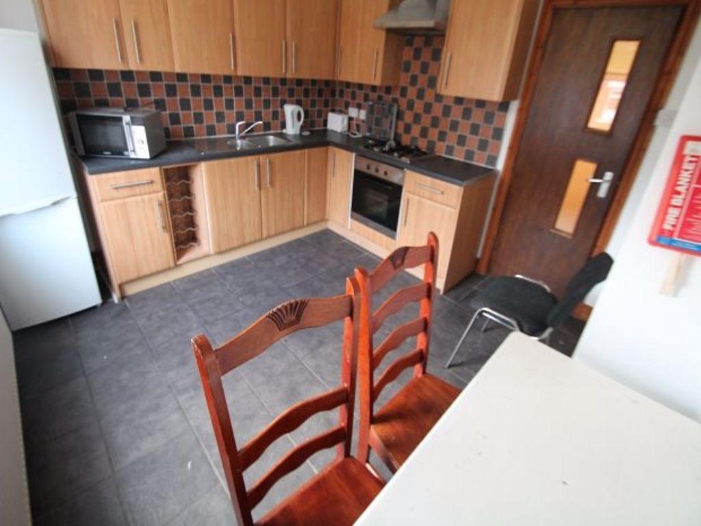 A bright and functional kitchen featuring ample...