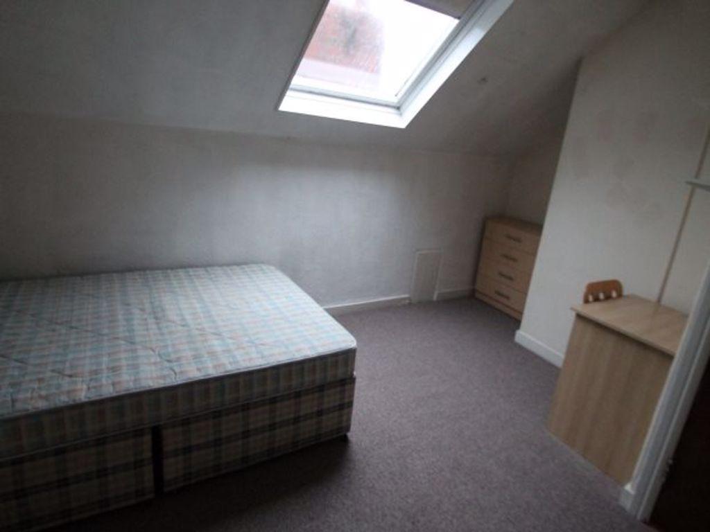 A simple, quiet double bedroom featuring a larg...