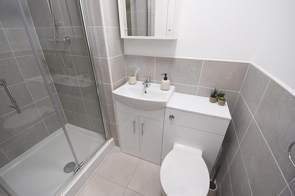 This modern bathroom features a sleek design wi...