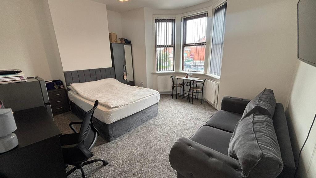 A spacious and well-maintained master bedroom f...