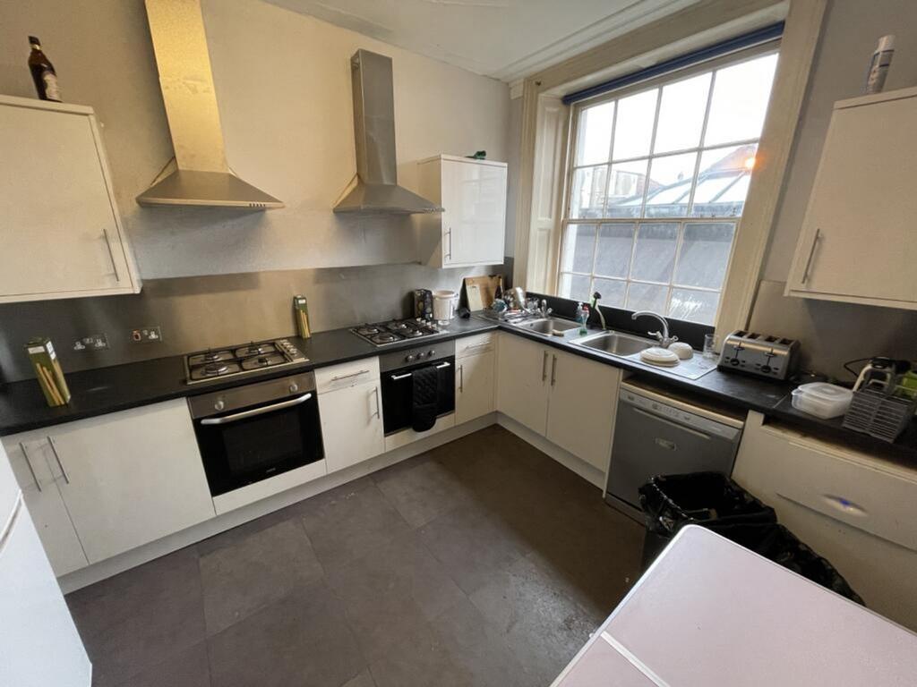 Spacious and modern kitchen featuring ample sto...