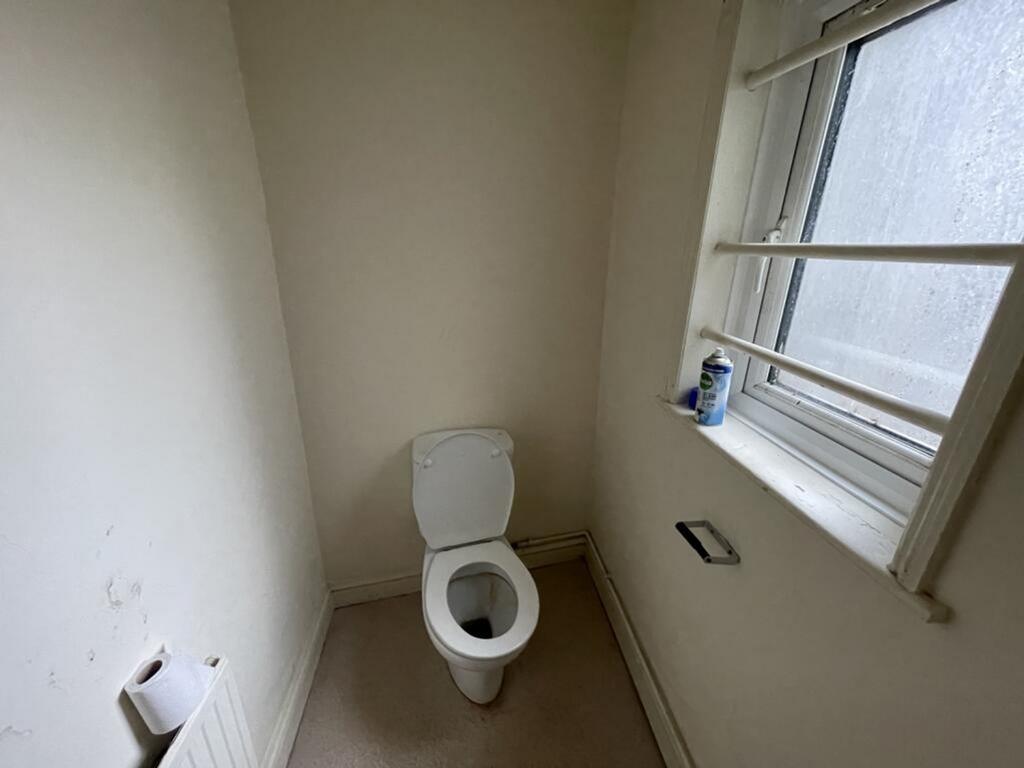 A compact and functional single toilet area fea...