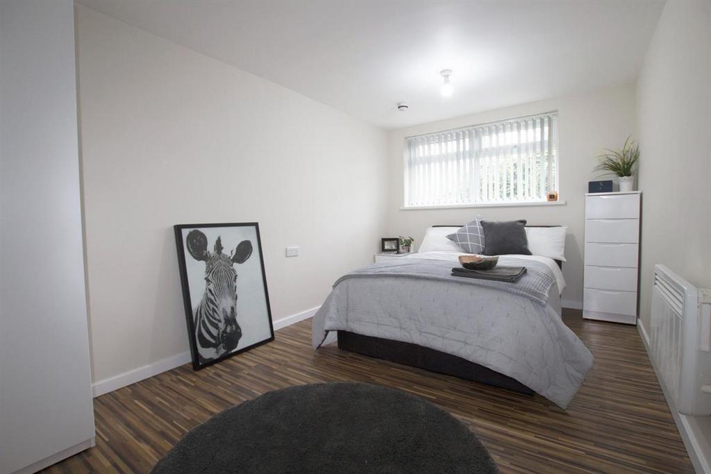 A bright and modern double bedroom featuring a ...