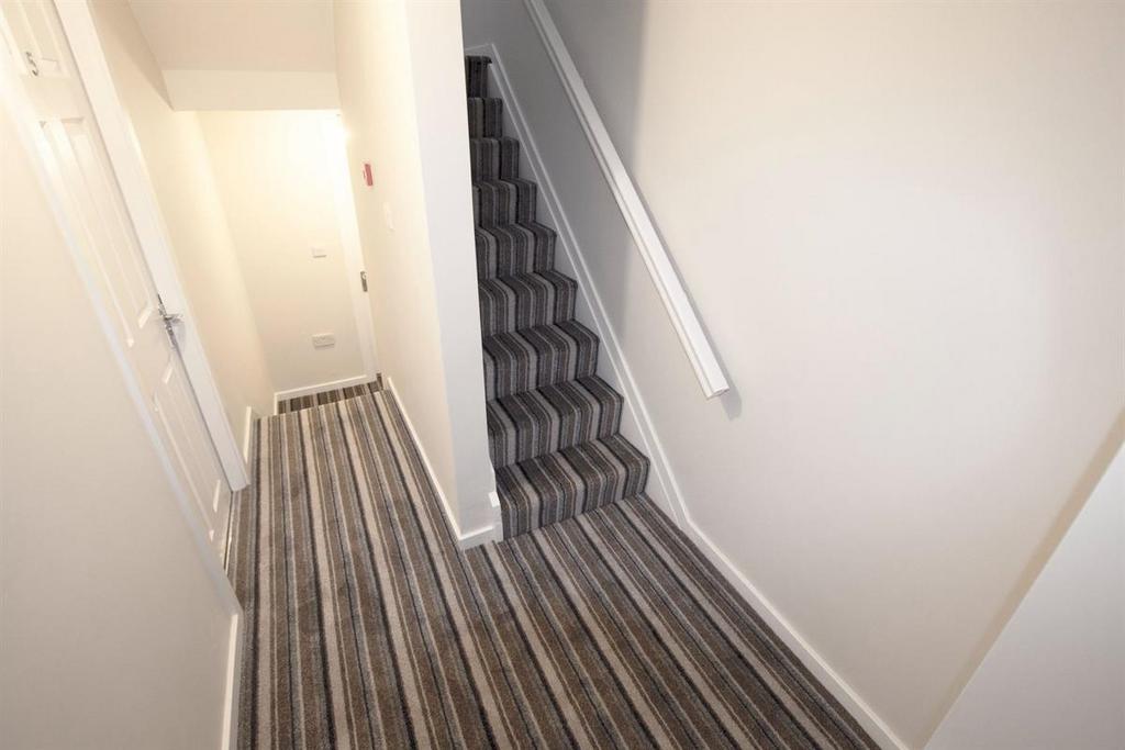 Bright and clean hallway featuring modern strip...