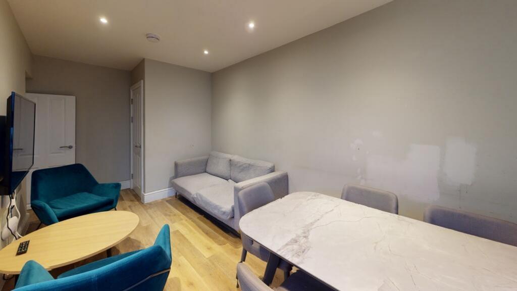 A stylish living room featuring comfortable sea...