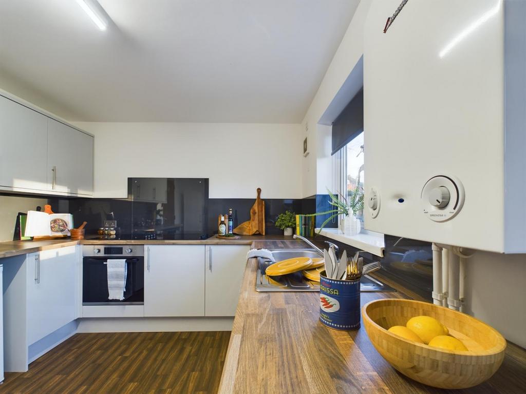 A bright and modern kitchenette featuring sleek...