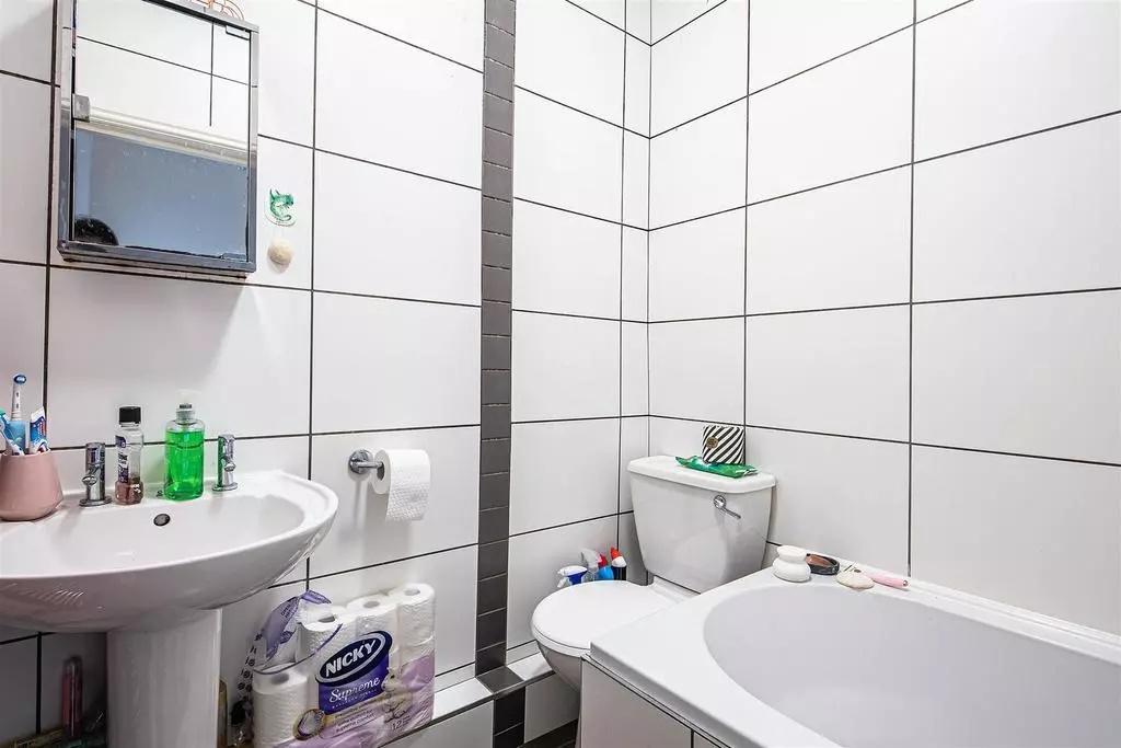 A clean and modern bathroom suite featuring a w...