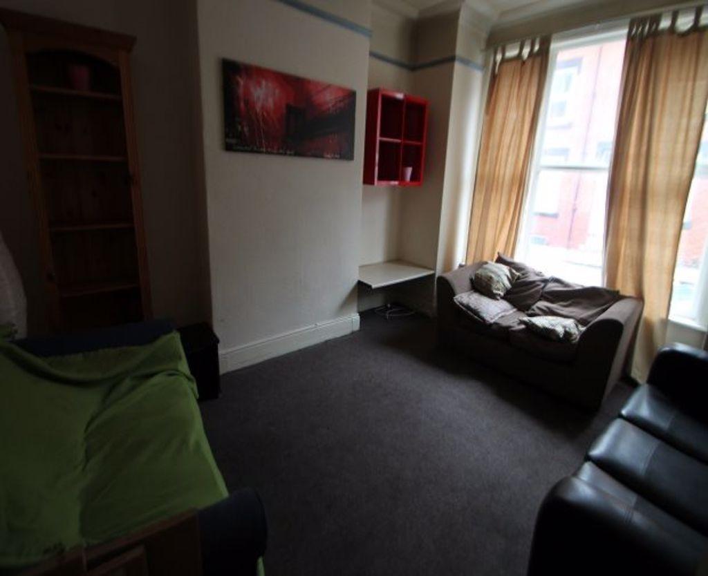 Cozy living room with a large window allowing n...