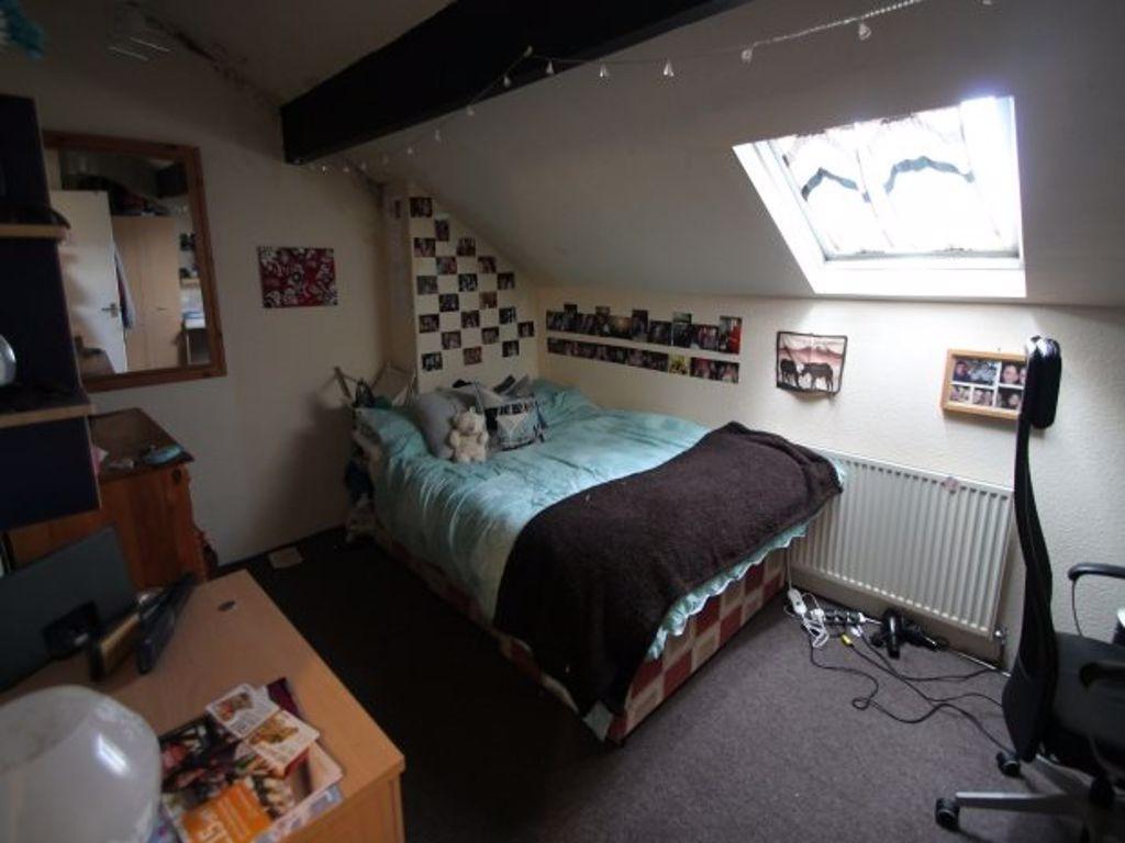 A cozy double bedroom featuring a comfortable d...