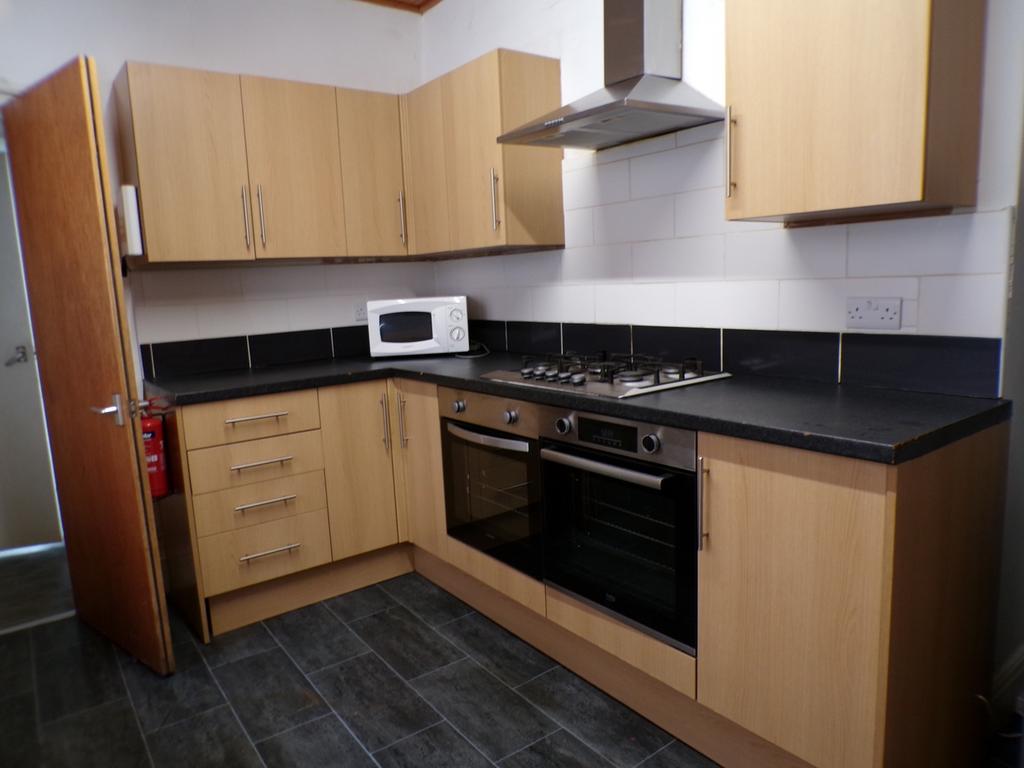 A modern and tidy kitchen with ample storage an...