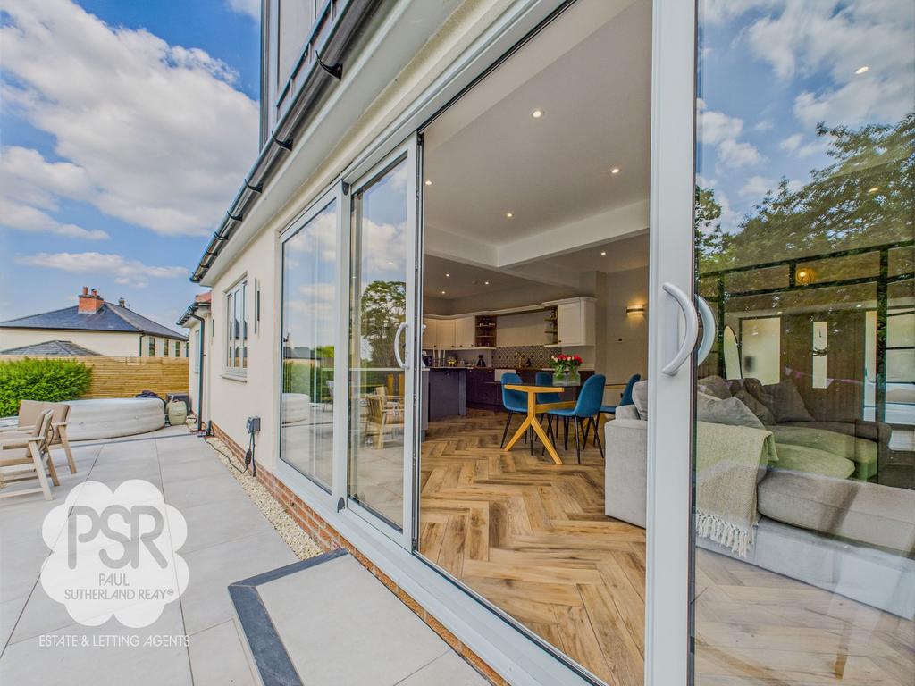 Large Sliding Doors to the Rear Patio for those...