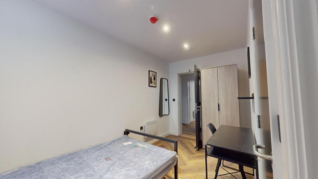 A spacious and inviting double bedroom, perfect...