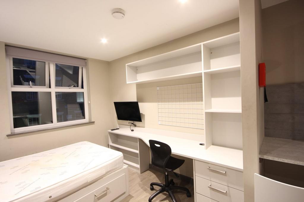 A bright and modern double bedroom featuring a ...