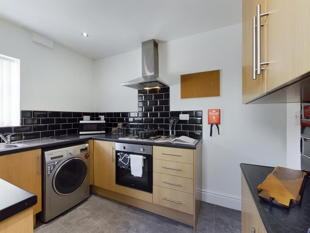 A modern and well-equipped kitchenette featurin...