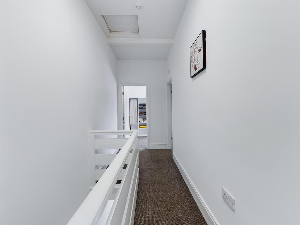 A clean and tidy hallway that provides a welcom...