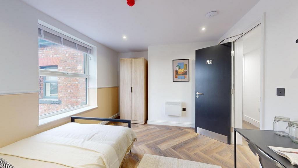 A stylish and well-lit double bedroom, perfect ...