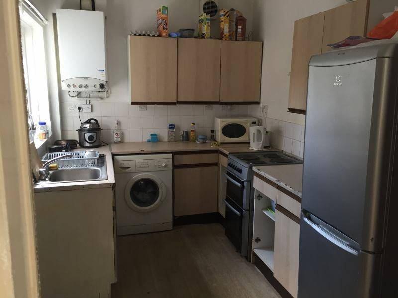 Compact kitchen with ample cabinetry, modern ap...