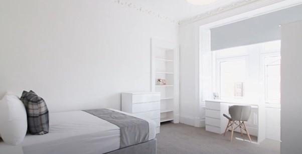 Bright and cozy single bedroom featuring a larg...