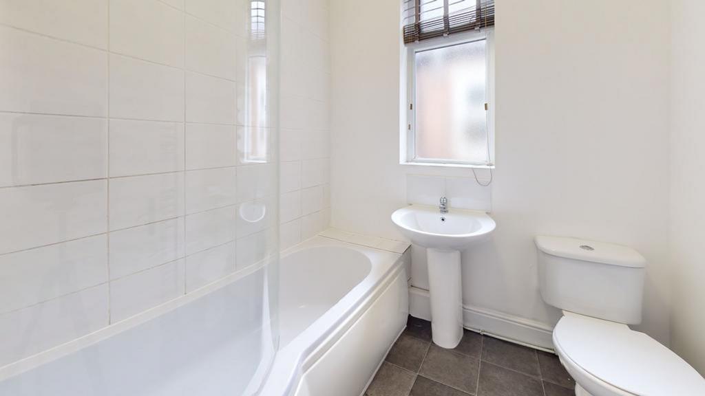 A bright and clean bathroom featuring modern fi...