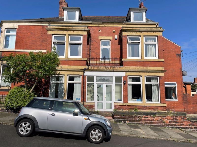 Charming front view of a traditional red-brick ...