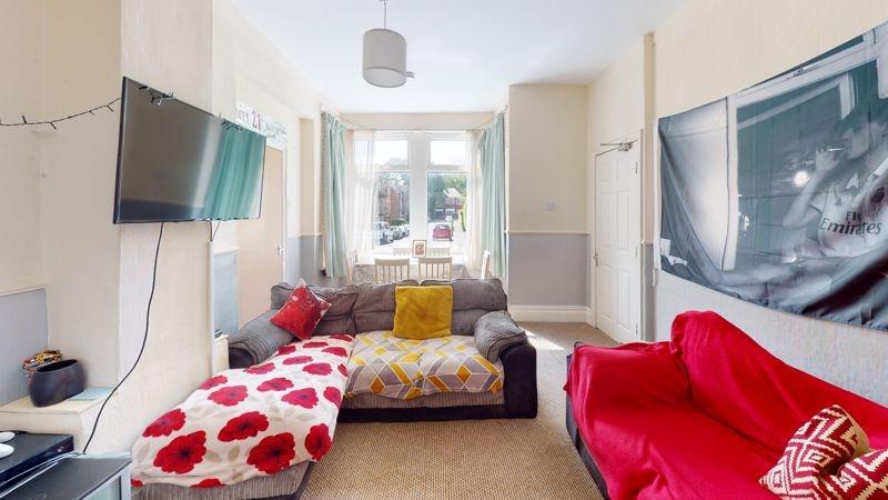 Bright and inviting living room featuring comfo...