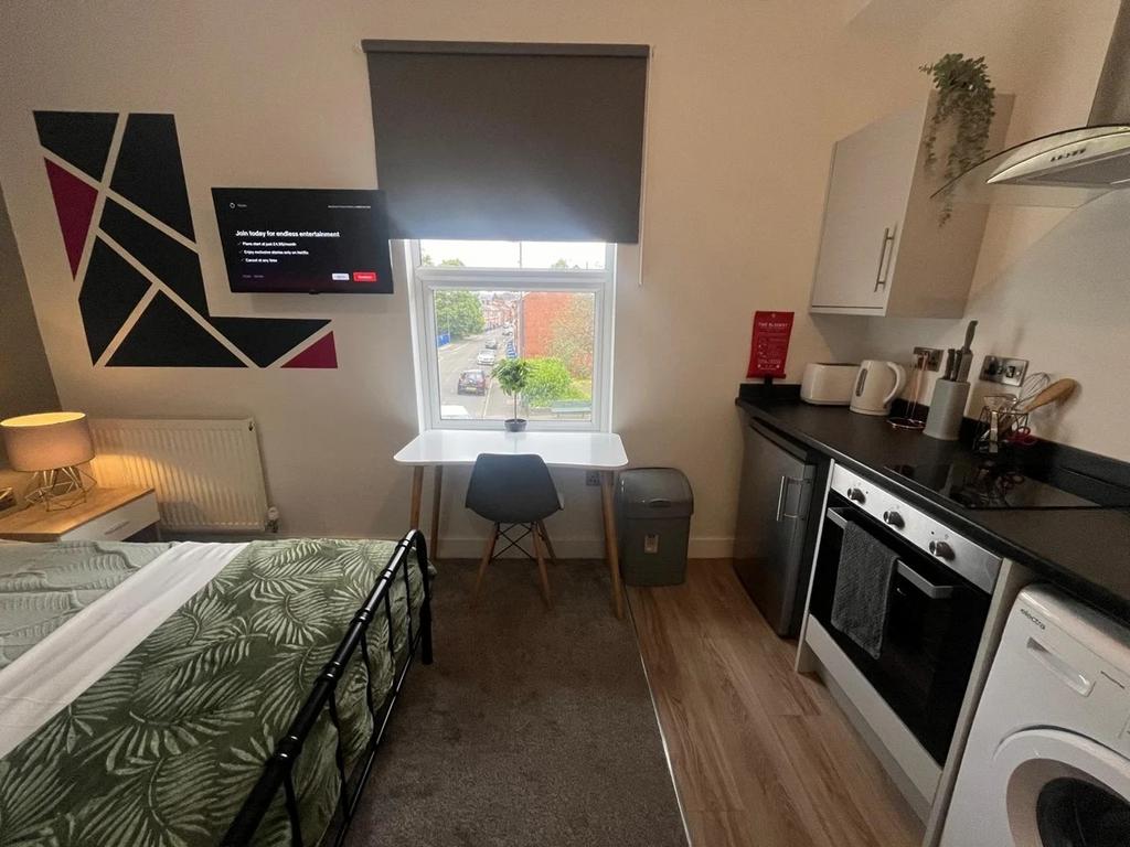 Bright and modern double bedroom featuring a co...
