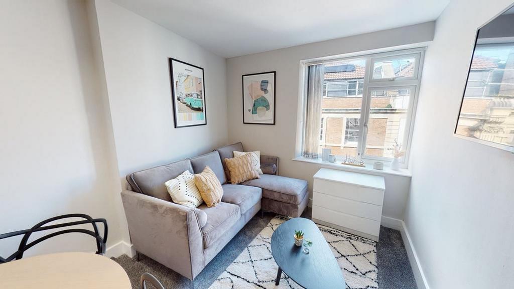 A bright and inviting living room with modern d...