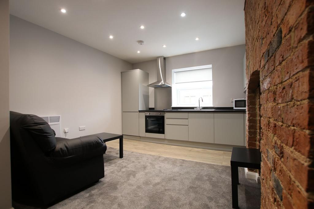A modern living room with a sleek, integrated k...