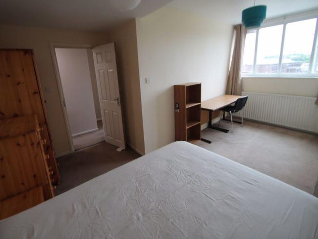 Bright and spacious master bedroom featuring a ...