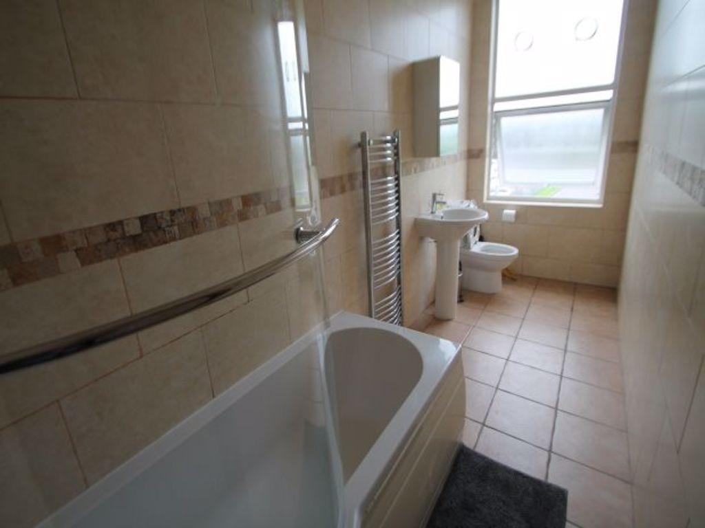 Bright and clean bathroom featuring a full-size...