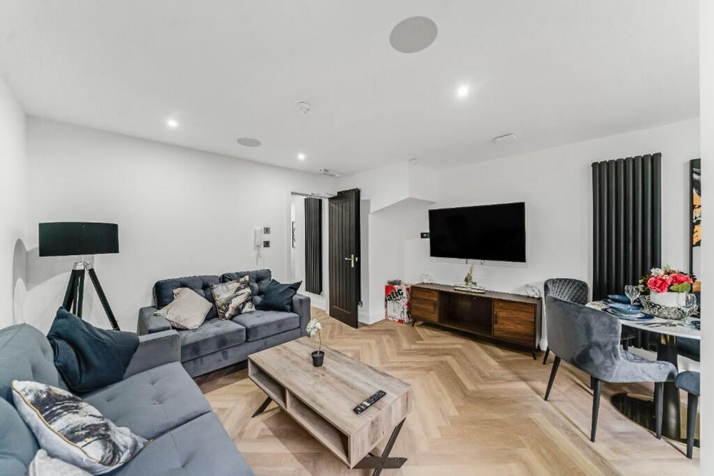 Stylish and contemporary living room featuring ...