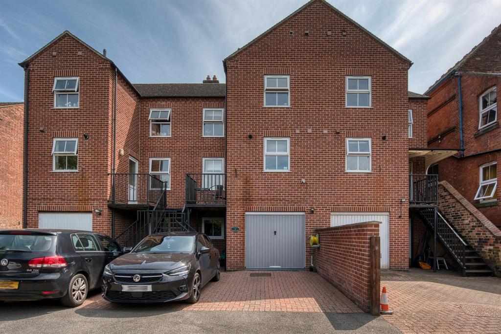 Rear of the home - parking and garage.jpg